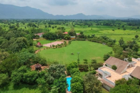 Nivaant Farms & Cottages - Nestled in lush greenery, offering a Swimming pool, Orchard, Jacuzzi & A spacious lawn with gazebo